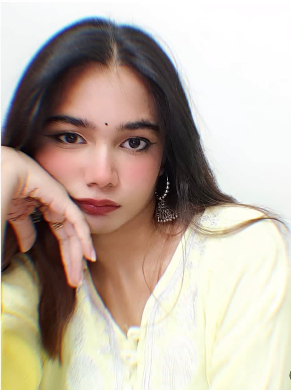Kahkasha in a soft yellow outfit with a calm expression